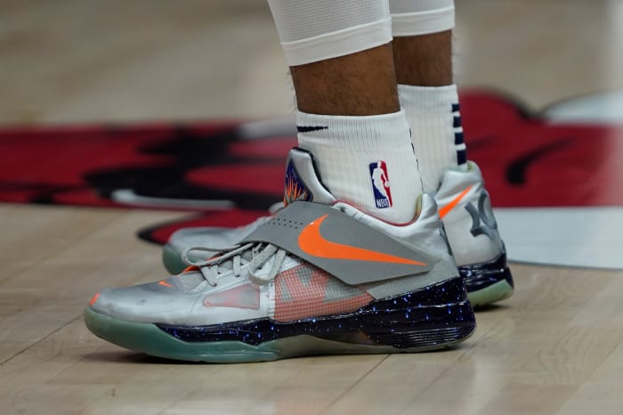 Kevin Durant's silver and orange Nike sneakers.